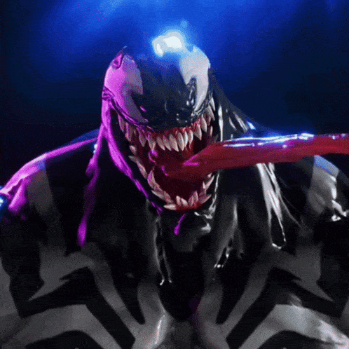 a close up of a statue of venom with his tongue sticking out