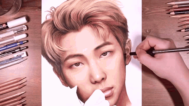 a person is drawing a picture of a young man