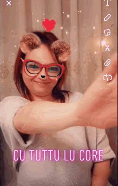 a woman wearing glasses and bear ears with the words cu tutto lu core written on the bottom