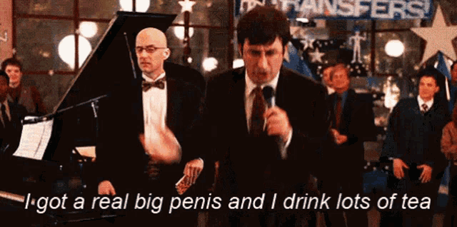 a man speaking into a microphone with the words i got a real big penis and i drink lots of tea