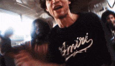 a man wearing a black t-shirt with the word empire on it
