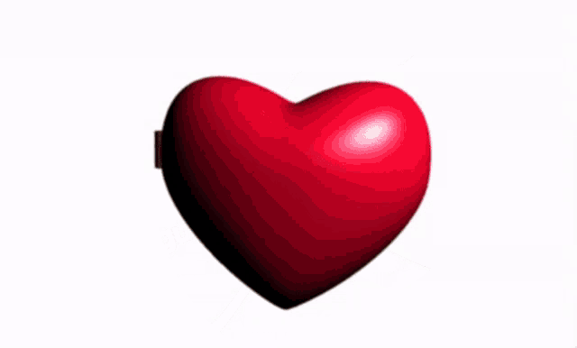 a heart shaped mirror has a picture of a man wearing glasses
