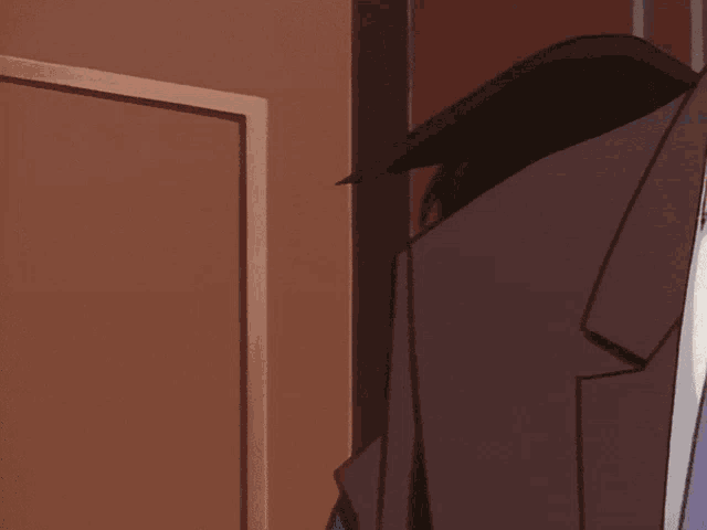 a man in a suit and tie holds another man 's head