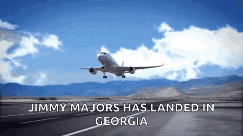 jimmy majors has landed in georgia with an airplane flying overhead
