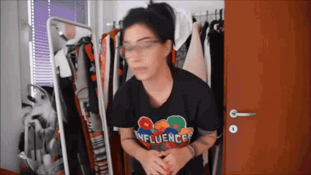 a woman wearing a t-shirt that says influencer on it