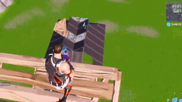 a man is sitting on a wooden fence in a video game while holding a gun