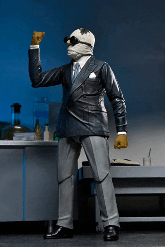 a figurine of a man in a suit with a mask on his head