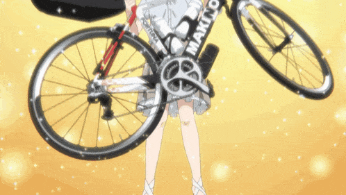 a girl is holding a bicycle that says maximo