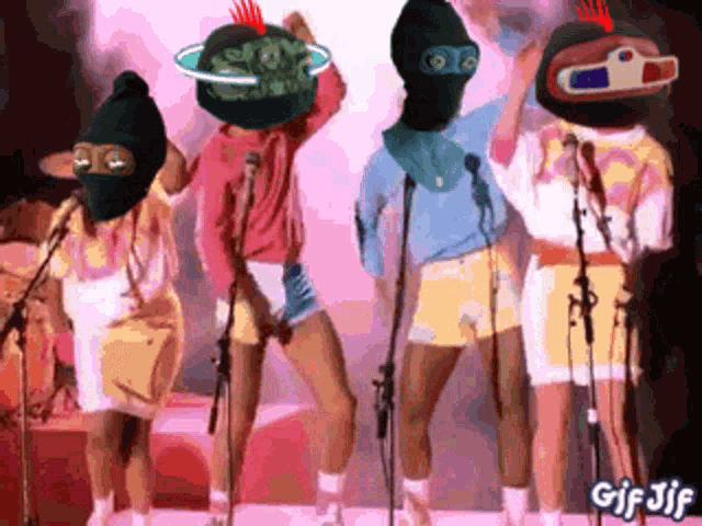 a group of people standing in front of microphones with gif jif written on the bottom right