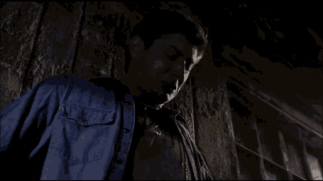 a man in a blue shirt with the word denim on it