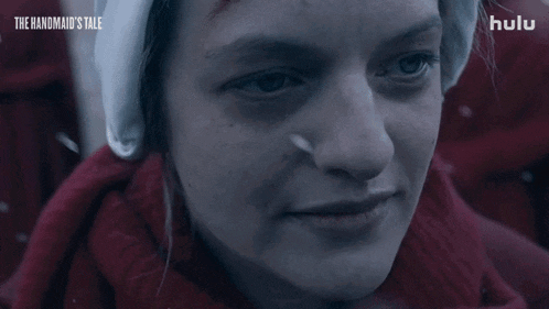 a woman from the handmaid 's tale says i 'm sorry in a close up