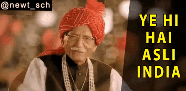 an older man wearing a red turban and pearls is standing in front of a sign that says ye hi hai asli india
