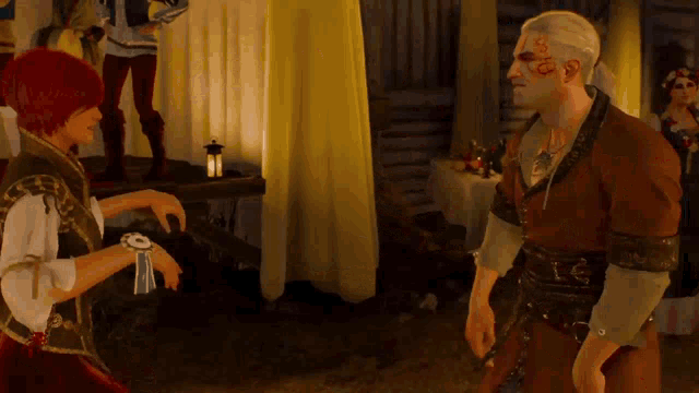 a man with a tattoo on his face is talking to a woman