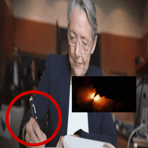 a woman signing a document with a red circle around it