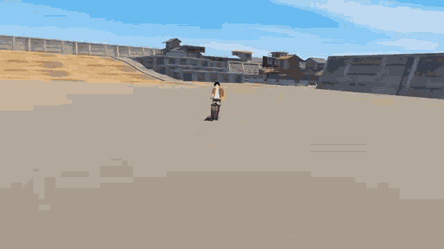 a person is riding a motorcycle on a dirt field