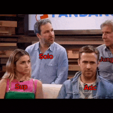 a group of people are sitting on a couch and one of them has the name solo on her shirt