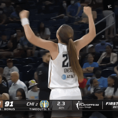 a female basketball player with the number 2 on her jersey
