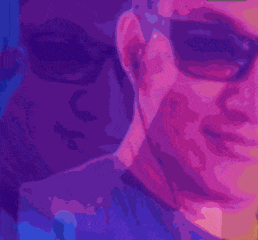 a man wearing sunglasses and a shirt with the name jake on it