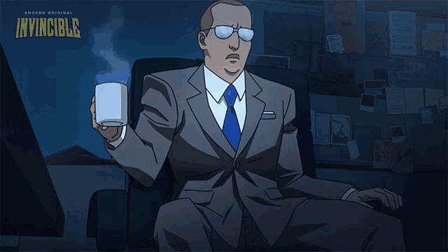 a man in a suit sits in a chair holding a cup of coffee with the word invincible on the bottom right