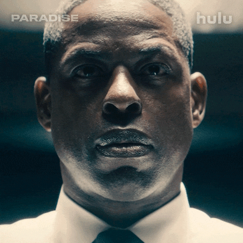 a close up of a man 's face with hulu written on the bottom right