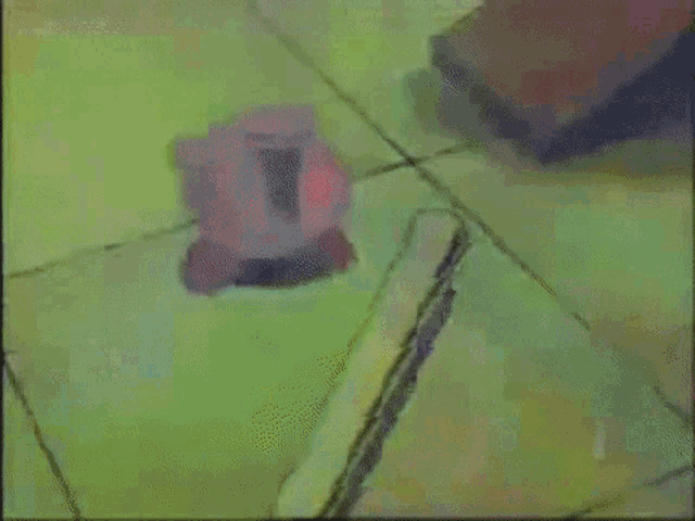 a pink cartoon character is walking on a yellow floor