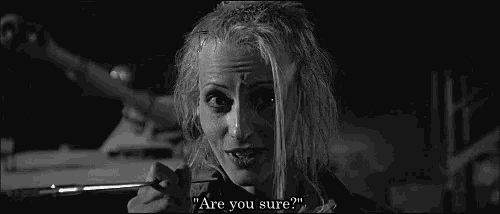 a black and white photo of a woman holding a pair of scissors and asking , `` are you sure ? ''