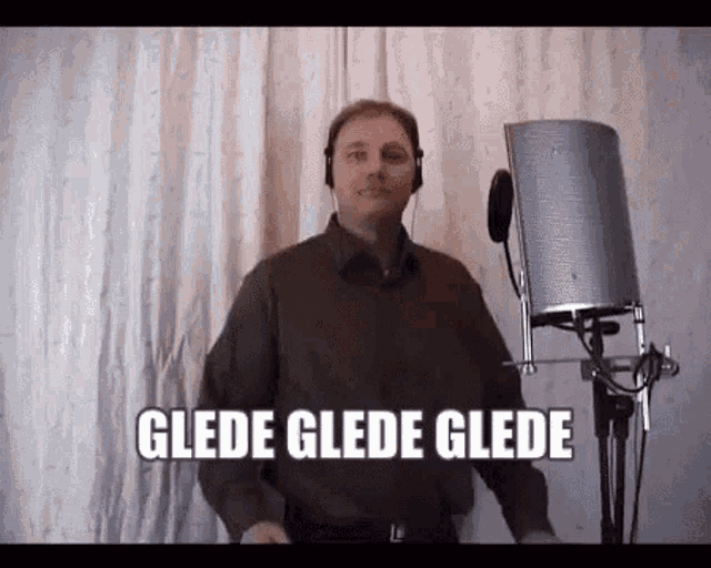 a man wearing headphones is standing in front of a microphone with the words glade glade glade written below him