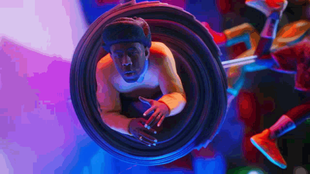 a man is looking through a camera lens with a purple background