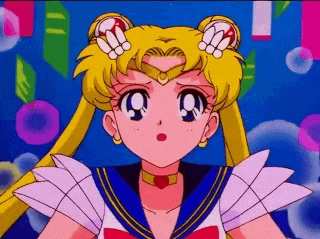 a close up of a sailor moon character with a surprised look on her face