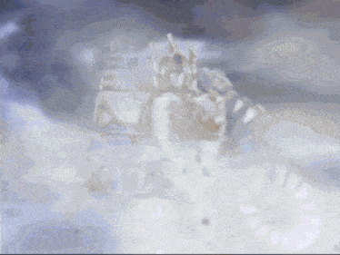 a blurred image of a statue of a lion in the snow