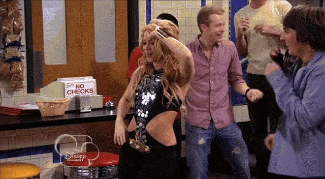 a group of people dancing in front of a no checks box