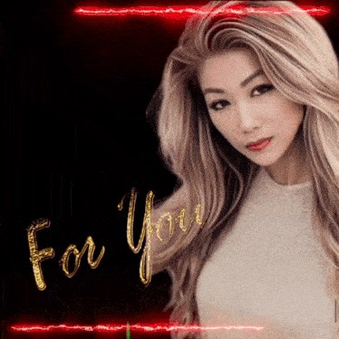 a woman with long blonde hair stands in front of a sign that says " for you "