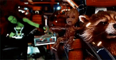 a blurred image of a rocket raccoon and a green frog