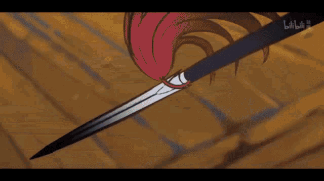 a close up of a person holding a brush with their hair .