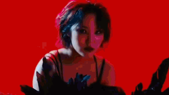 a blurry picture of a woman standing in a dark room