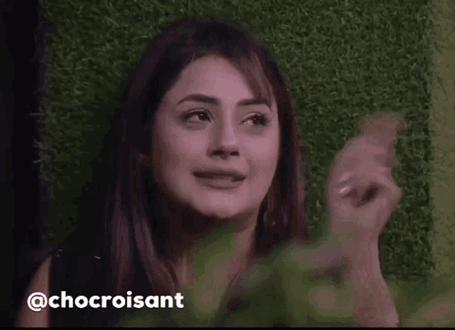 a close up of a woman 's face with the words chocroissant behind her .