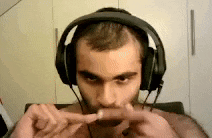 a man wearing headphones is eating a sausage