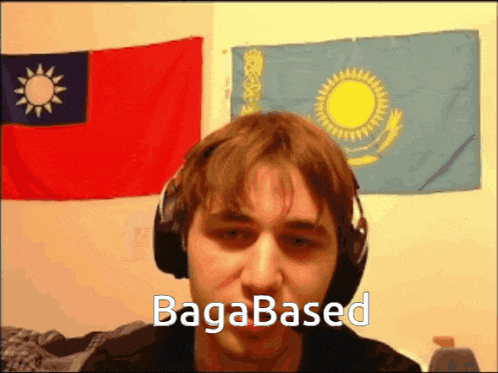 a man wearing headphones says bagabased in front of some flags