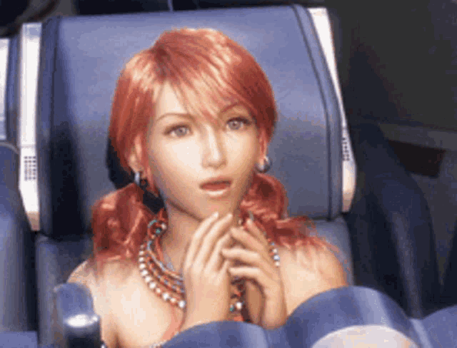 a woman with red hair sits in a blue chair