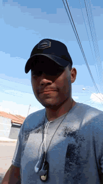 a man wearing a hat that says ' oakley ' on it