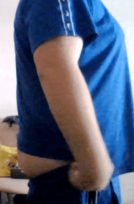 a person wearing a blue shirt with white buttons on the sleeves
