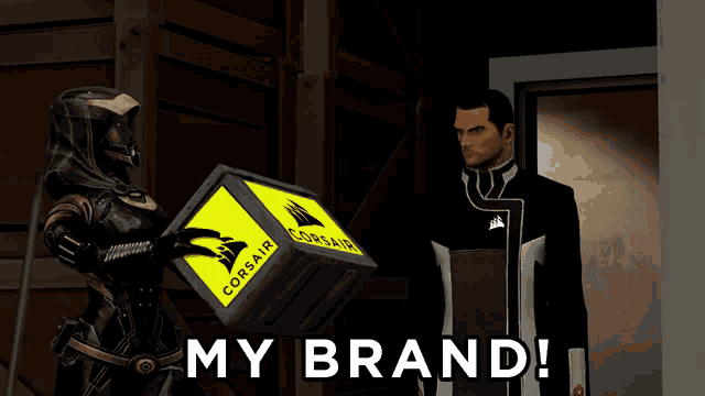 a man and a woman are holding a box that says corsair on it