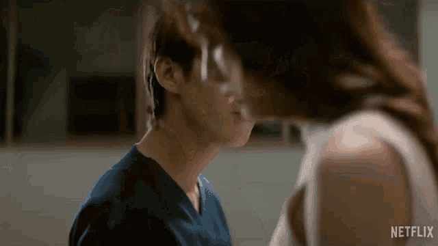 a man and a woman are kissing in a netflix trailer .
