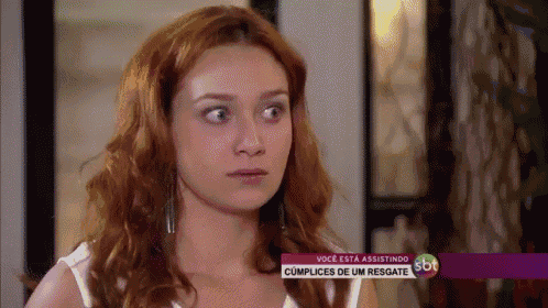 a woman with red hair is on a sbt tv screen