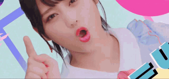a close up of a woman 's face with her mouth open and her finger pointing up