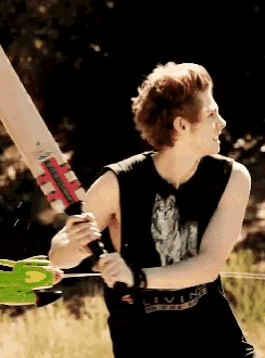 a man in a black tank top with a wolf on it