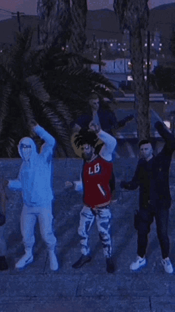 a man in a red lb sweatshirt is dancing with his hands in the air
