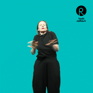 a woman in a black shirt is dancing in front of a blue background that says rozbark