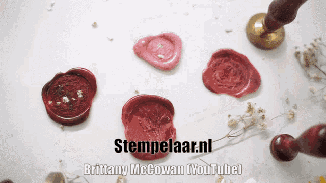 red wax seals on a white surface with stempelaar.nl brittany mccowan youtube written on the bottom