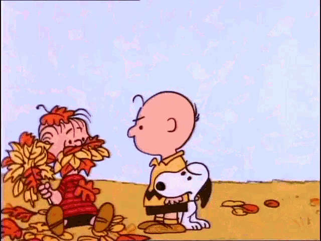 a cartoon character is holding a lollipop in a field .